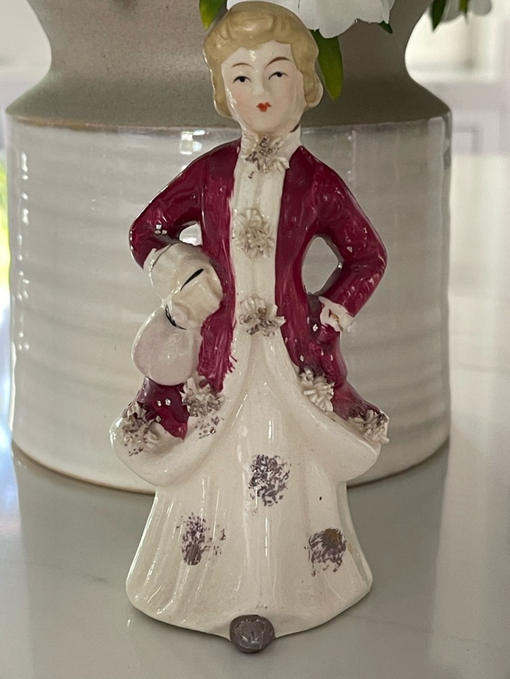 vintage porcelain figurine of a Victorian-style lady